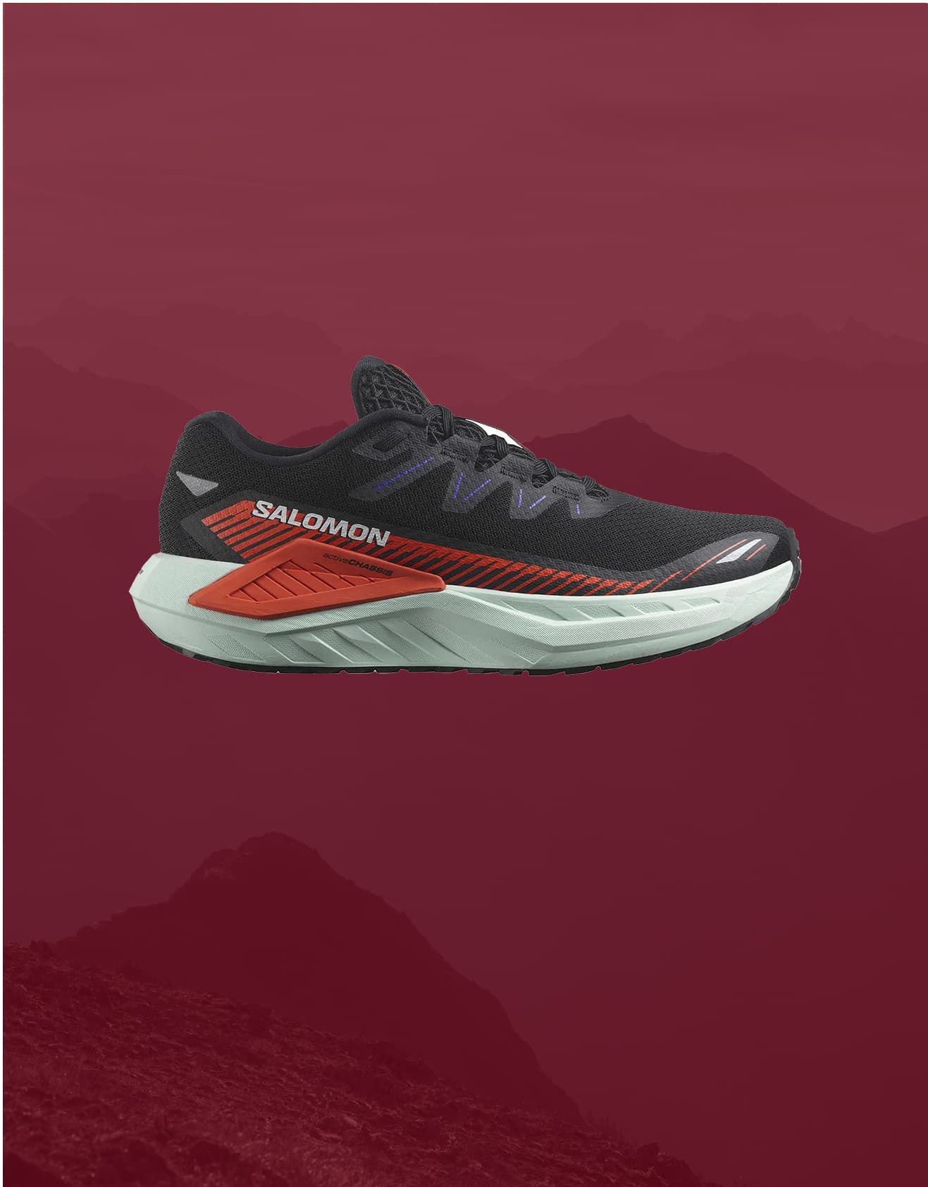 Black running shoe with a white sole, displayed against a maroon background with faint mountain silhouettes.