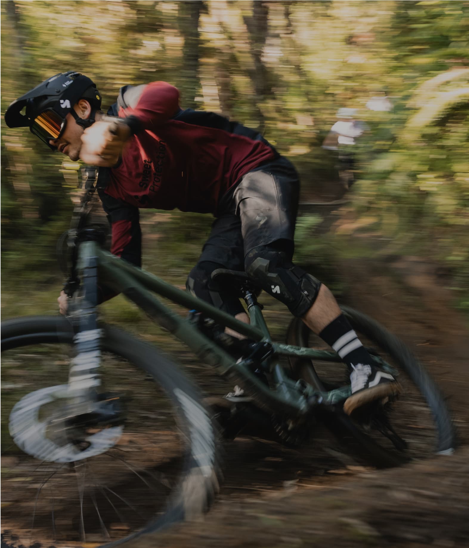 Mountain biker in motion on a forest trail.